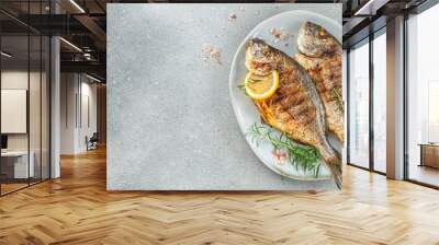 Grilled dorado fish and lemon. Healthy food. roasted dorado. Detox and clean diet concept. place for text, top view Wall mural