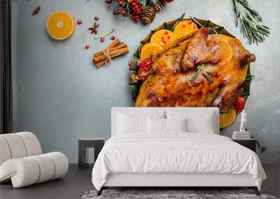 Homemade baked duck with rosemary and oranges. Crispy whole roast duck. Thanksgiving or Christmas dinner. place for text, top view Wall mural