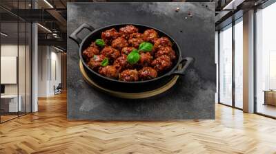 Meatballs with tomato sauce in frying pan on dark background, Long banner format. top view Wall mural