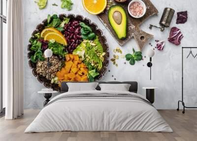 Quinoa salad in bowl with avocado, sweet potato, beans on gray background. superfood concept. Healthy, clean eating concept. Vegan or gluten free diet. top view Wall mural