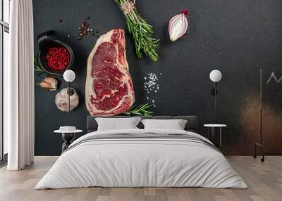 Raw New York steak on a dark background. banner, menu, recipe place for text, top view Wall mural