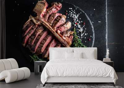 T bone steak is grilled sliced on a piece. Aged Barbecue Porterhouse Steak American meat restaurant served on slate board. banner, catering menu recipe place for text, top view Wall mural