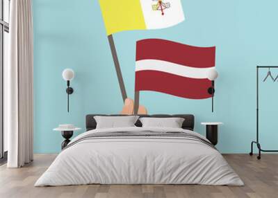 Flags of Vatican City and Latvia, Hand Holding flags Wall mural