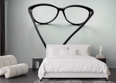 black glasses on a white background Wall mural