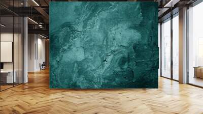 Old green concrete wall surface. Сrumbled. Close-up. Dark teal rough background for design. Wall mural