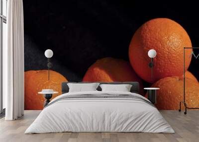 fresh wet oranges on black background,heathy food Wall mural