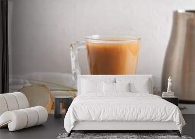 Freshly brewed coffee with milk on wood board with sliced loaf Wall mural