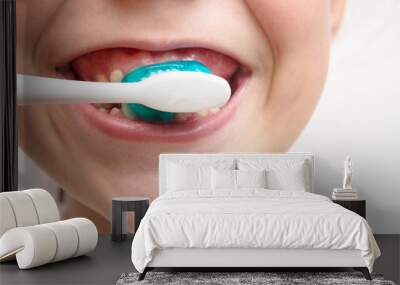 Girl brushing cleaning teeth. Girl with toothbrush. Oral hygiene Wall mural