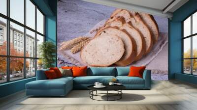 sliced bread on a board. onion bread Wall mural