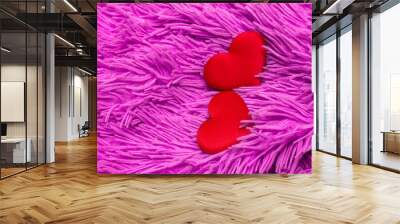 two red textile hearts on a plush juicy acid pink plaid; for the design of valentines and wedding invitations Wall mural