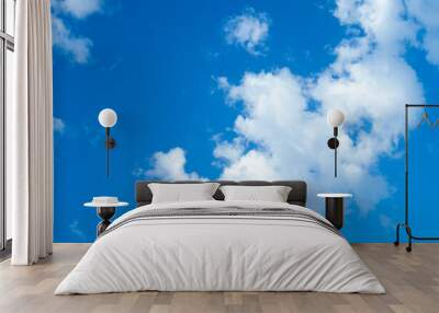 Clouds in a blue cloudy sky Wall mural