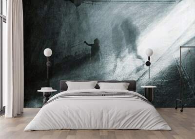 The silhouette of a person walks along a road that gracefully splits into two paths, symbolizing the choices and journeys that lie ahead. Wall mural