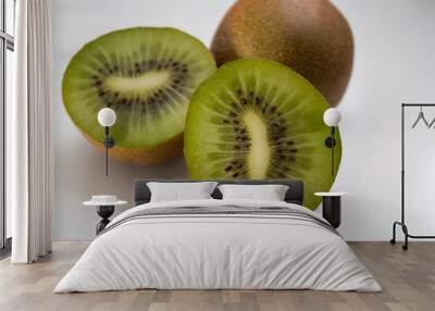 one whole kiwi and 2 kiwi halves on a white background. High quality photo Wall mural