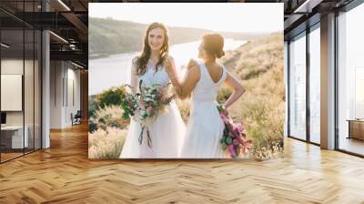 Lesbian wedding couple in white dresses Wall mural