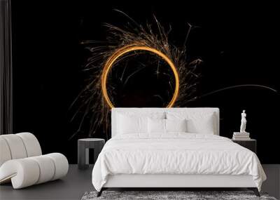 Circular lights with sparks on a black background Wall mural