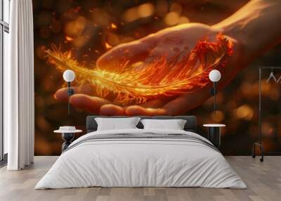 Feather in hand on the background of a beautiful gold bokeh Wall mural