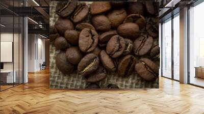 Coffee beans close up on a plain background top view Wall mural