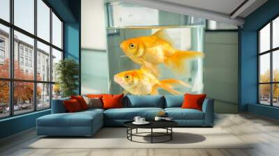 On the windowsill is an aquarium with goldfish. Wall mural