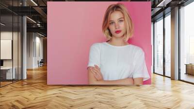 Cute young woman blonde hair with bob haircut pink background Wall mural