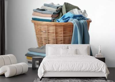 Laundry basket with clothes on a white background Wall mural