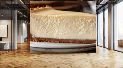 A slice of New York-style cheesecake with a graham cracker crust and a rich, creamy filling. Wall mural