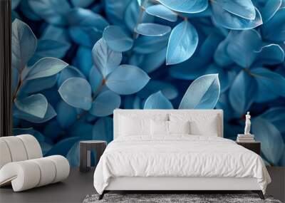 blue plant leaves in the nature in fall season, blue background Wall mural