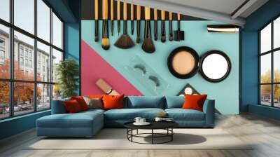 color background with makeup brushes and products flat lay.  Wall mural