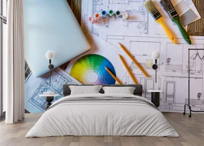 Flatlay interior design with laptop and colour circle diagram, plans and art tools Wall mural