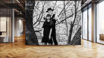 The masked maniac is preparing to attack the girl from behind. Black and white photo. Halloween. Wall mural