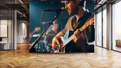 Guitarist on stage. A musical group performs on a concert stage. A musical group performs in a recording studio. Wall mural