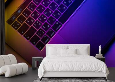 MacBook Pro keyboard illuminated by gradient Wall mural