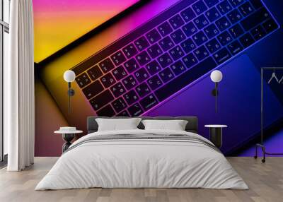 MacBook Pro keyboard illuminated by gradient Wall mural