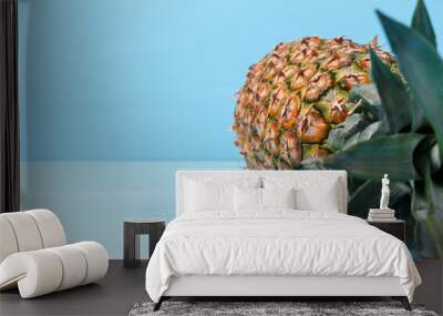 The real pineapple on a blue wooden background, place to place the text Wall mural