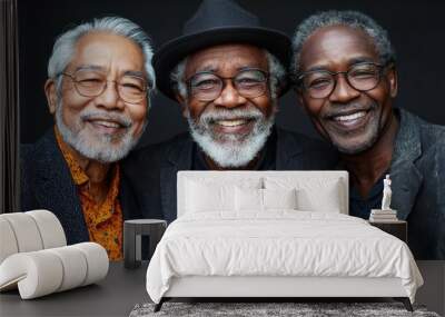 Three older men smiling together in casual attire against a dark background, capturing a moment of friendship and joy Wall mural