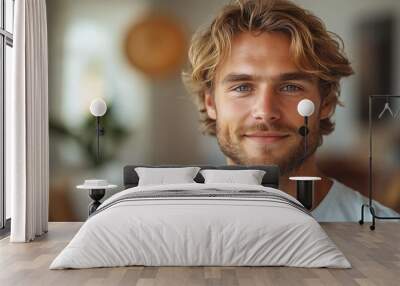 portrait of caucasian softly smiling man is 35 years old with blond hair in white T-shirt, copy space, closeup Wall mural