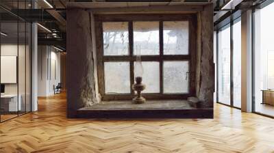 Photo of a window with a kerosene lamp on the windowsill in an old peasant house Wall mural