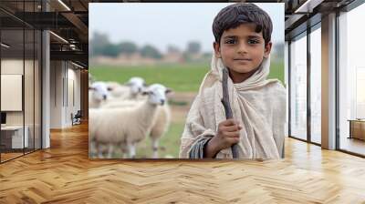 A young boy in traditional attire stands confidently with his staff, surrounded by a flock of sheep, amidst the tranquil beauty of a rural Japanese landscape Wall mural