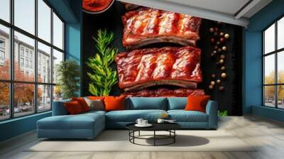 Delicious meat ribs are neatly arranged on a slate board alongside bowls of spices and fresh herbs, indicating preparation for a flavorful meal Wall mural