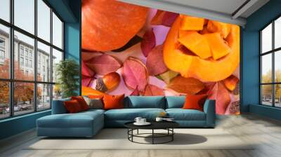 fresh whole pumpkin, pieces of pumpkin on a background of autumn leaves. Autumn background. Wall mural