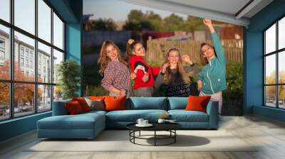 Girls in the style of the nineties. Country girls posing for the camera. Wall mural