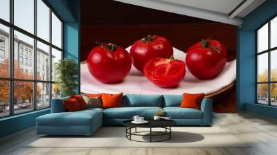 tomatoes on a wooden plate with a white napkin Wall mural