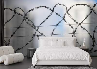 barbed wire on a fence, close up Wall mural