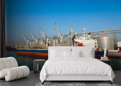 A cargo transport ship is moored at the pier in the port of Constanta Romania. Wall mural