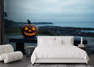 A creepy pumpkin for Halloween celebration is lying on the table Wall mural