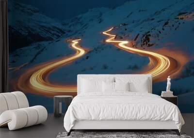 Highway lights on a winding road covered with snow at night Wall mural