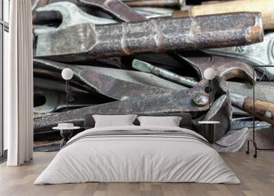 A box with a set of old rusty locksmith tools. Wall mural