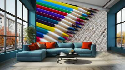 Set of colorful pencils on burlap. Wall mural