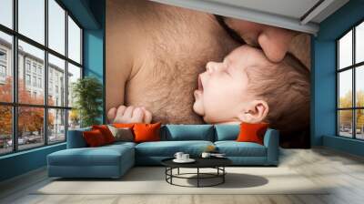 newborn child and father Wall mural