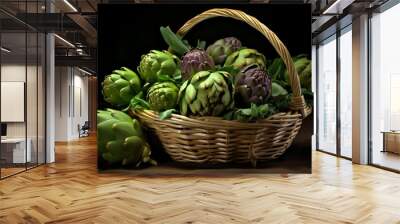 artichokes in a wicker basket on a black background. Wall mural