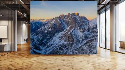 An incredible sunset in the Dolomites Alps in the Tre Cime di Lavaredo national park in january 2020 in Italy. Aerial drone shot Wall mural